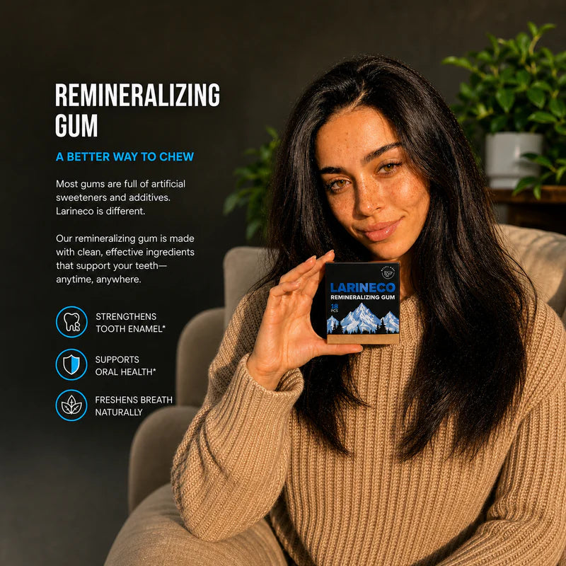 Woman holding a box of Larineco remineralizing gum with product details on a dark background