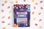 Package of Mushroom Gummies with colorful gummy bears on a white background