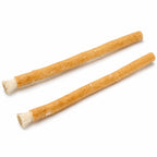 Two Miswak sticks side by side with toothbrush bristles exposed